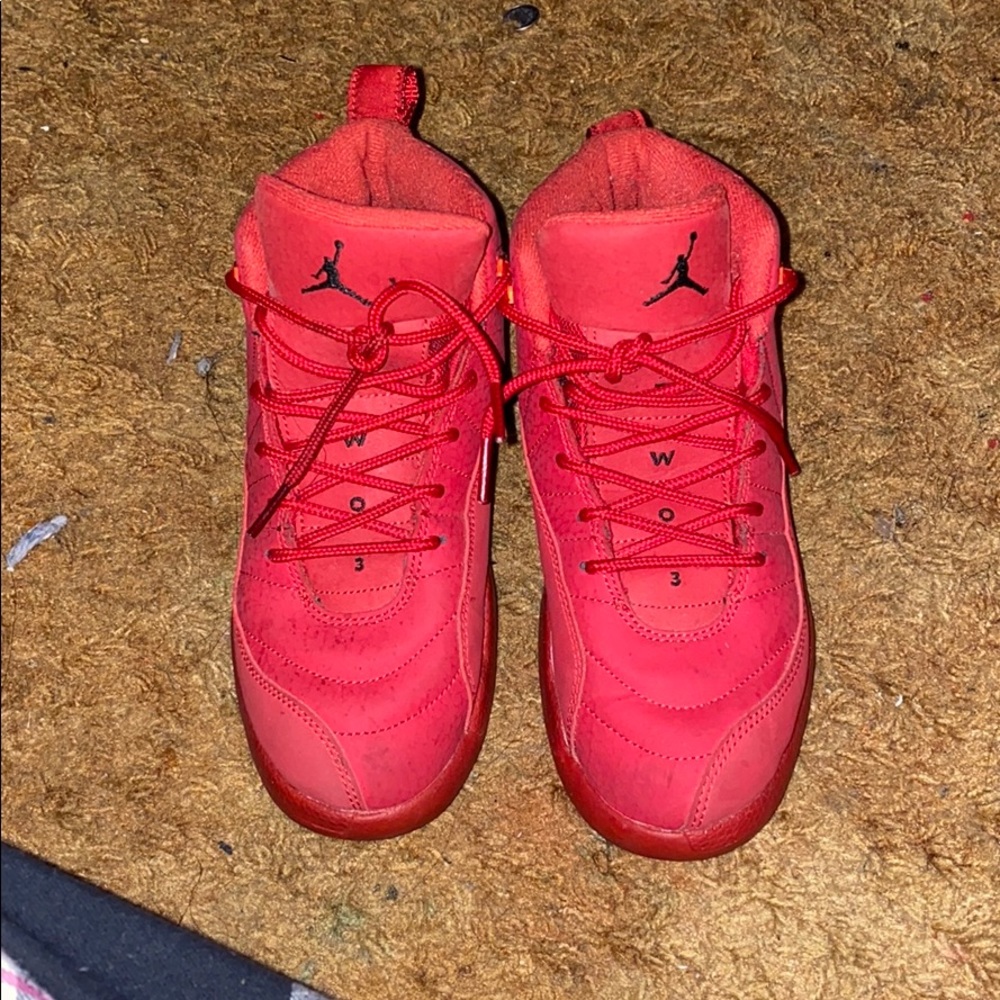 All red Jordan 12s